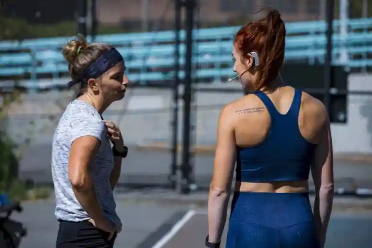 Meg Takacs coaching with whoop
